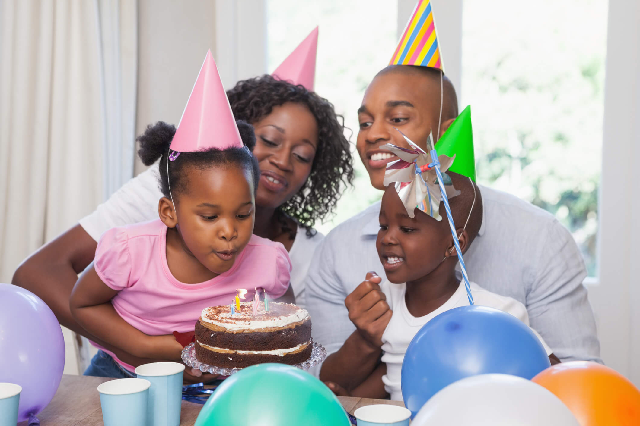 Happy family celebrating a birthday together